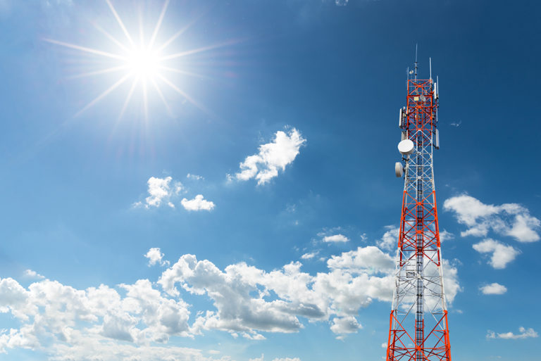 Telecommunication Radio Antenna and Satellite Tower with blue sky